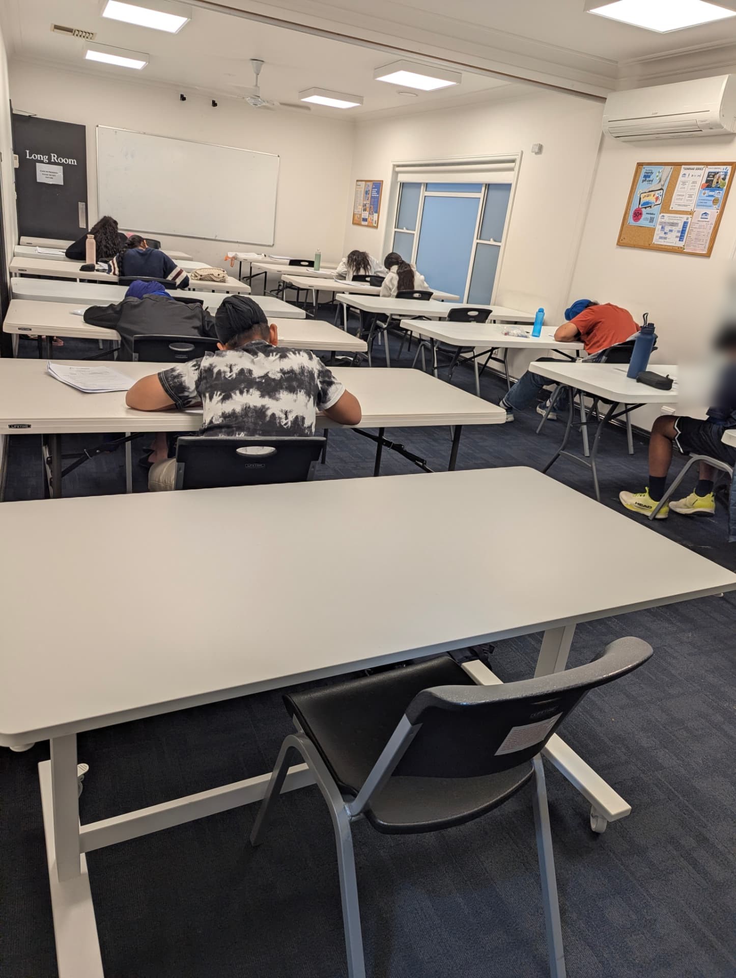 A trial examination room with students seated apart at individual desks